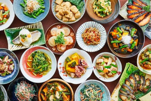 a table full of bowls of different types of food at Hotel Emion Kyoto in Kyoto