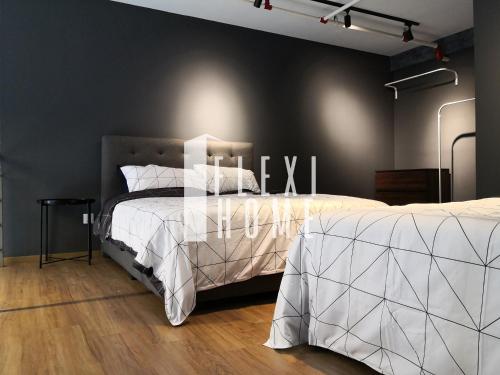 a bedroom with two beds with white comforter at NETFLIX-Pinnacle PJ, Fantastic City View, 1-6 Guests Designed Duplex Home by Flexihome-MY in Petaling Jaya