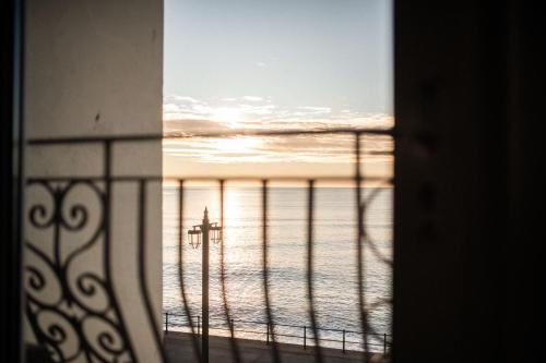 a view of the ocean from a window at The Elizabeth in Sidmouth
