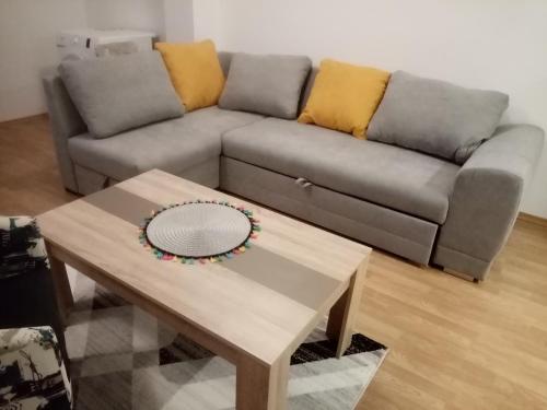 a living room with a couch and a coffee table at FLAMANITA APARTMENTS in Skopje