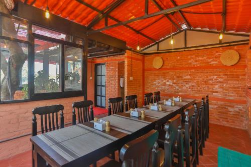 a dining room with a long table and chairs at Kathmandu Cottage - Boutique in Kathmandu