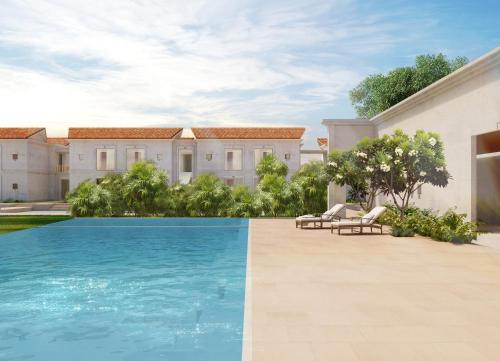 an image of a house with a swimming pool at Marasa Sarovar Premiere, Bodhgaya in Bodh Gaya