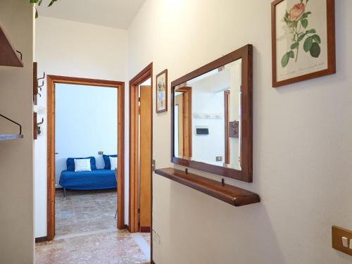 a mirror on a wall in a room at Appartamento Ghisallo in Magreglio