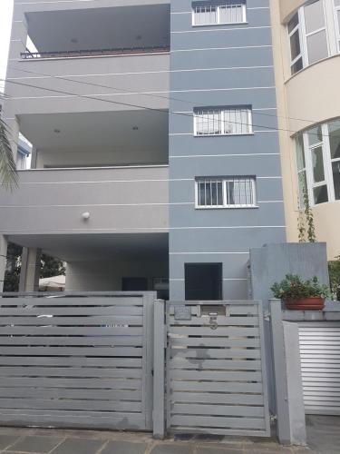 a building with a fence in front of it at Julia's Residence in Nicosia