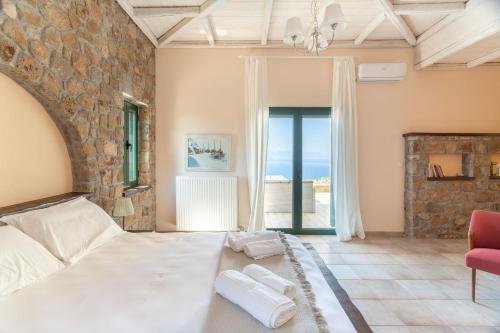 Voodi või voodid majutusasutuse Villa Archangelos Aegina toas