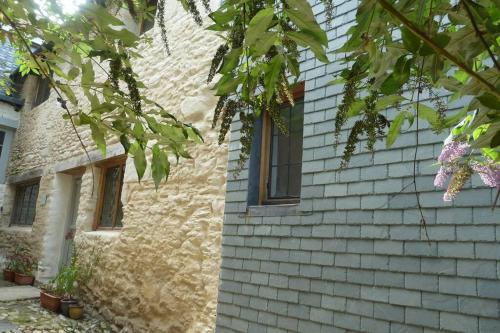 a brick house with a window on the side of it at The Merchant's House in Penryn