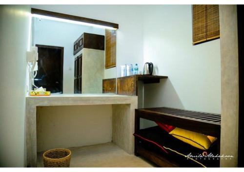 a small kitchen with a counter and a window at Serendib Signature Resort in Digana
