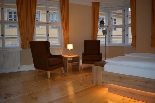 Kunsthaus mit Frühstück im Hotel Theophanoにあるベッド
