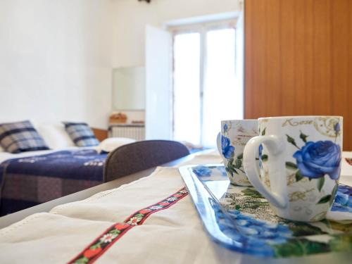 a coffee cup and a plate on a table at Appartamento Ghisallo in Magreglio