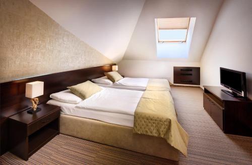 Postel nebo postele na pokoji v ubytování Hotel Grand Jasna