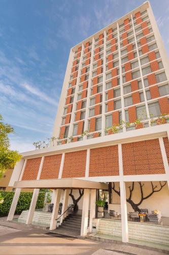 a tall building with stairs in front of it at Jetwing Colombo Seven in Colombo