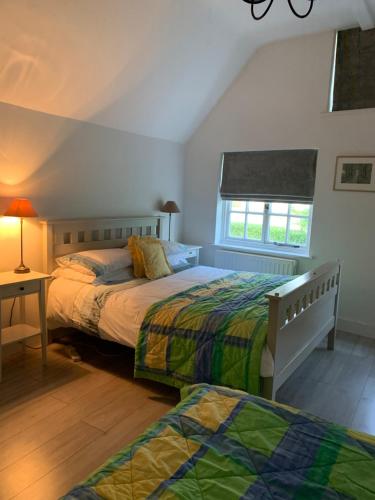 מיטה או מיטות בחדר ב-Appletree Cottages