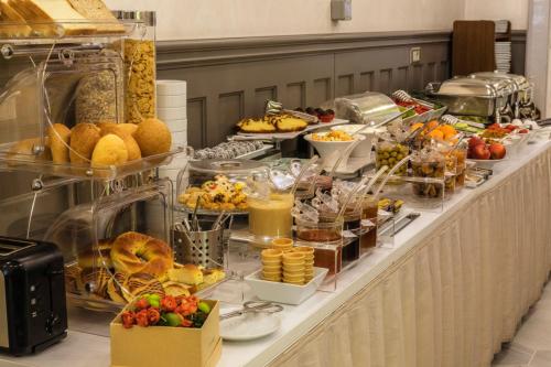 a buffet line with many different types of food at Meroddi Bagdatliyan Hotel in Istanbul