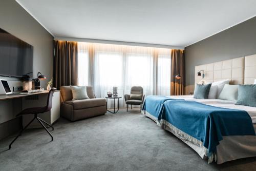 Postel nebo postele na pokoji v ubytování Clarion Hotel Gillet