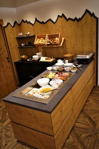 a buffet line with many different types of food at Bucheggerhof in Schladming