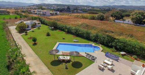 an aerial view of a yard with a swimming pool at Oasea in Tavronitis