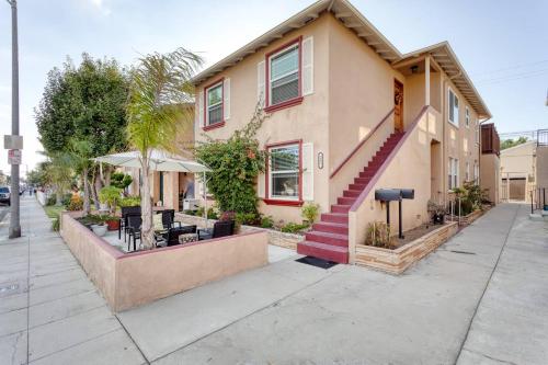 a house on a street with a table and chairs at New Belmont Shore Retreat with free Parking Walk to Beaches in Long Beach