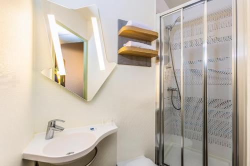 a bathroom with a sink and a shower at ibis budget Paris Porte d'Italie Est in Le Kremlin-Bicêtre