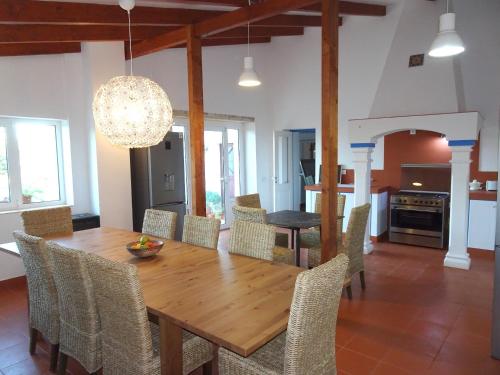 a dining room with a wooden table and chairs at Gold - Private Pool - 18 Guests - Albufeira in Albufeira