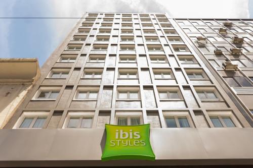 a building with a sign on the side of it at ibis Styles Buenos Aires Florida in Buenos Aires