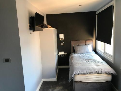 Postel nebo postele na pokoji v ubytování Cozy Rooms