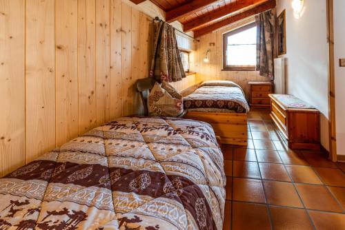 Postel nebo postele na pokoji v ubytování Casa dal Ri'