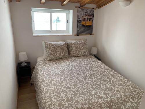 Кровать или кровати в номере Studio ensoleillé avec terrasse proche d'Amoreiras