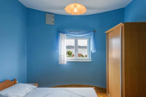 Postel nebo postele na pokoji v ubytování Apartments Golubić