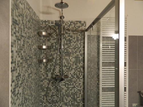 a bathroom with a shower with a glass door at B&B Corte Preare in Lavagno