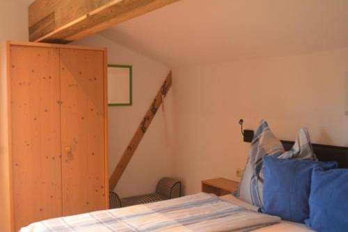 a bedroom with a bed and a ladder at Ramseiderhof in Saalfelden am Steinernen Meer