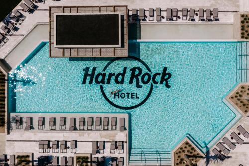 a sign that is on top of a building at Hard Rock Hotel Los Cabos in Cabo San Lucas