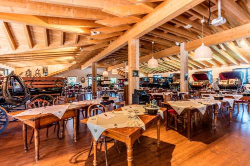 a restaurant with tables and chairs in a room at Hotel Restaurant Krone & Wellness - Schopfheim in Schopfheim