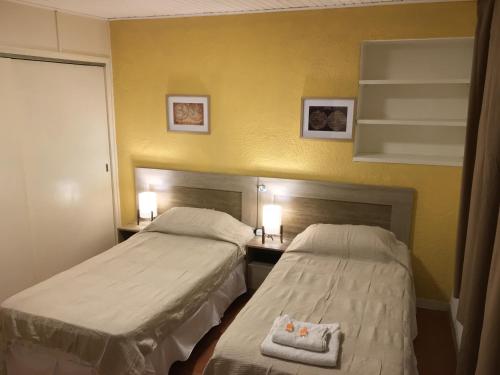 Cama o camas de una habitación en Hotel Colonial