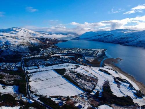an aerial view of a city and a body of water at Number 27 in Ullapool