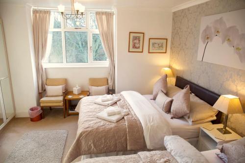 a bedroom with a bed and a window at Villa Marina in Scarborough