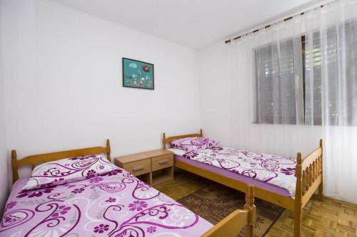 Postel nebo postele na pokoji v ubytování Apartman Laurus Malinska