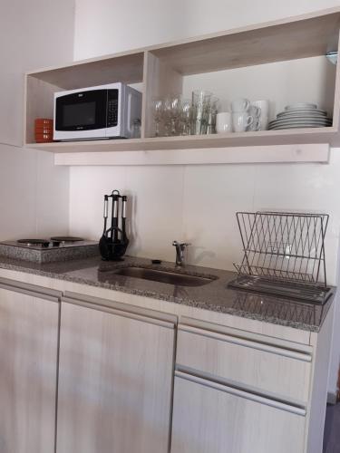 Una cocina o cocineta en Complejo Verde Memoria