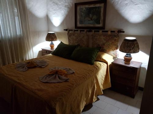 מיטה או מיטות בחדר ב-Cabañas La Polaca 1