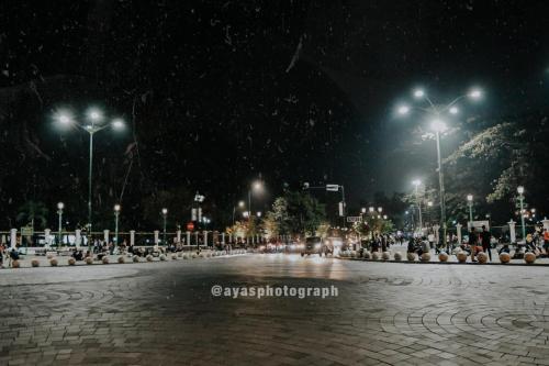 a city street at night with snow at Griya Suryo Wijilan in Yogyakarta