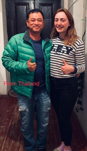 a man and a woman standing next to each other at Butichi Guest House in Chiatʼura