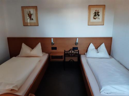
Ein Bett oder Betten in einem Zimmer der Unterkunft Pension Benedikt
