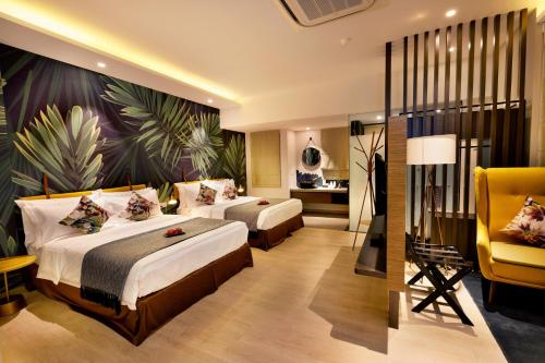 Postel nebo postele na pokoji v ubytování Sojourn Spa Hotel Ipoh