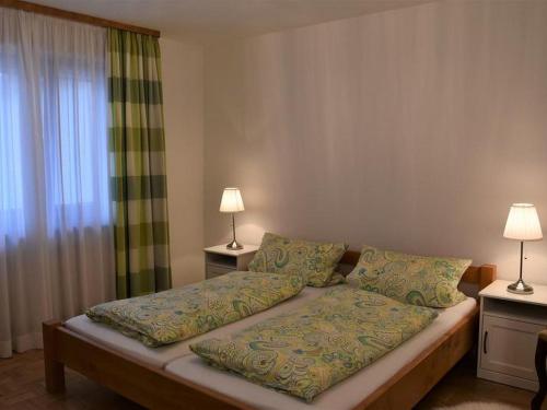מיטה או מיטות בחדר ב-Ferienwohnung Sonja
