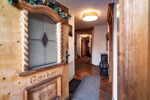 a hallway of a house with a window at Alpin View in Zellberg