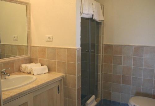 a bathroom with a sink and a shower at Casa Bithia in Chia