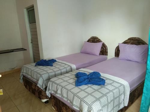 מיטה או מיטות בחדר ב-Dasi Guesthouse
