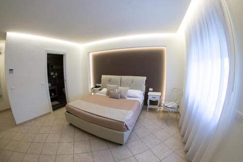 Postel nebo postele na pokoji v ubytování Hotel Victoria