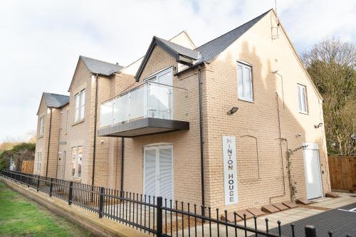 a house with a balcony on the side of it at Citystay Living - Hinton House in Cambridge