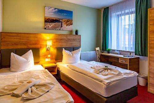 Postel nebo postele na pokoji v ubytování City-Hotel-Wolgast