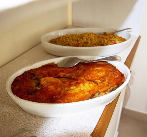 two dishes of food sitting on a table at Hotel Victoria in Torre Santa Sabina